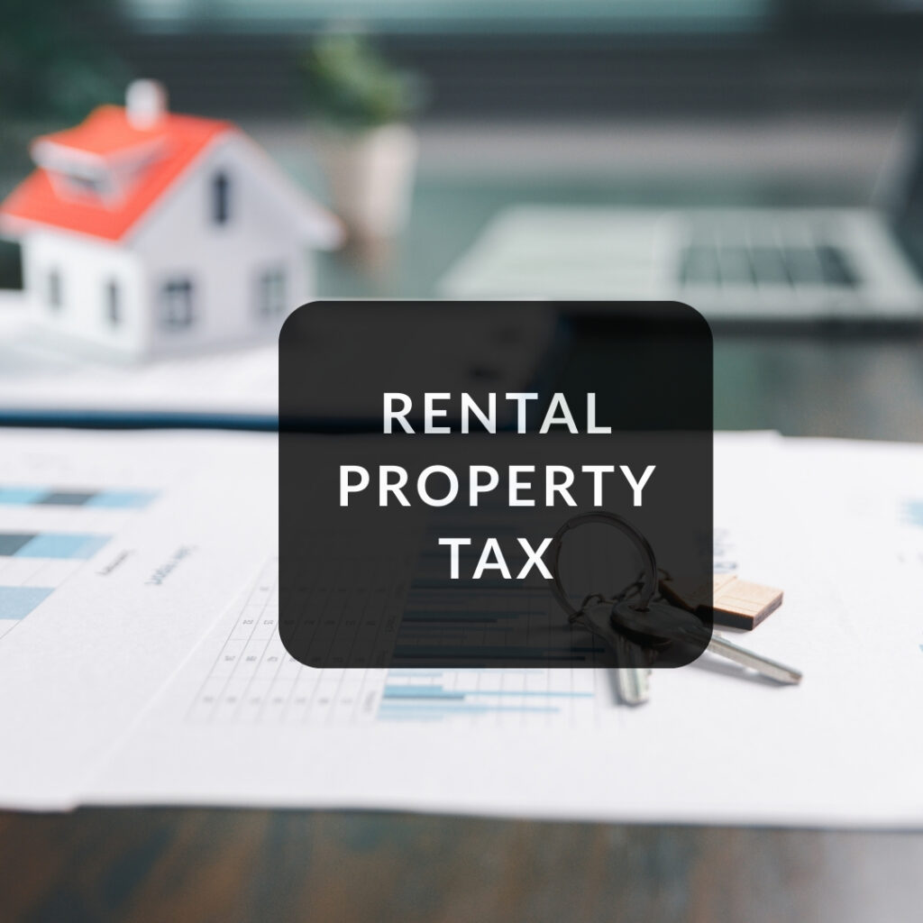 Rental Property Tax documents and keys placed on a desk, illustrating tax-related paperwork for real estate investors.