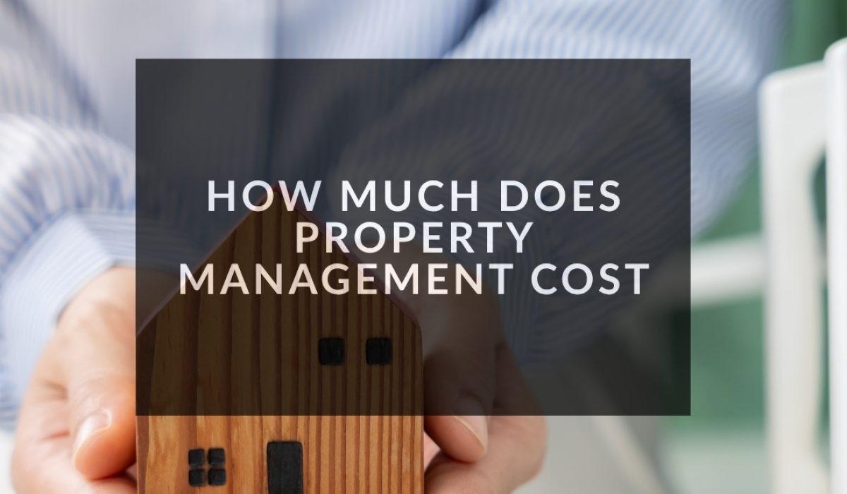 how much does property management cost illustrated by a person holding a small wooden house in their hands